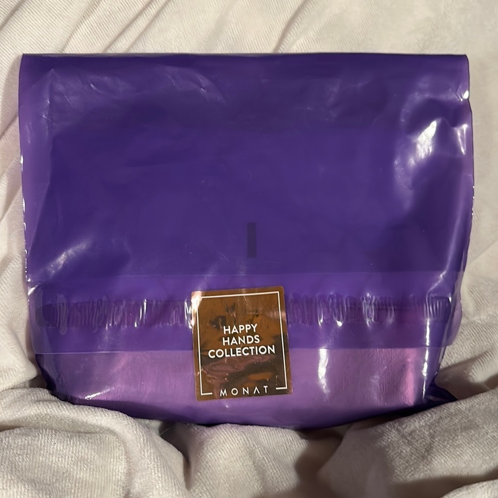 COPY - Sealed, NIP, MONAT “Happy Hands” from gift collection last year.